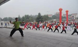Wang teaching students in China