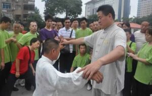 Wang teaching Tai Chi to student in China